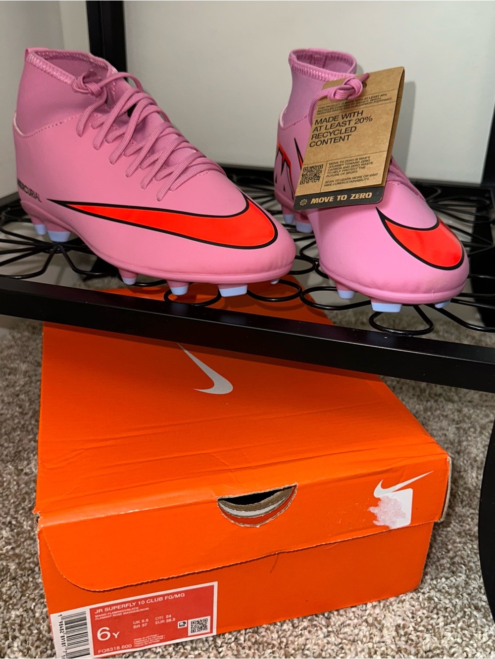 Nike Kids Pink Soccer Cleats with Red Swoosh